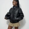 grok-image-369f75b0-5c3b-4066-af1a-6dff10edd0b9 The Nova Jacket – Women’s Oversized Faux Leather Jacket – Minimalist Streetwear