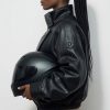 grok-image-372d5c6e-3f0e-4002-b2a1-9e2adbc89e79 The Nova Jacket – Women’s Oversized Faux Leather Jacket – Minimalist Streetwear